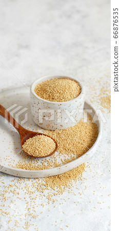 Bowl of Raw Amaranth Grain with a spoon Bowl of Raw Amaranth Grain with a spoon 66876535