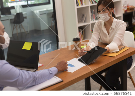 Asian business man and women talk about job and wear masks.New nomal 66876541
