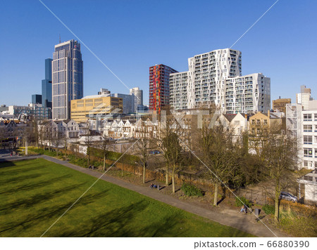 View from park at Most Expensive living buildings in Rotterdam, The Netherlands. Unusual Designed Architecture near the Central railway Station View from park at Most Expensive living buildings in Rotterdam, The Netherlands. Unusual Designed Architecture near the Central railway Station 66880390