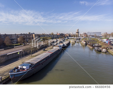Aerial Shot of Channel in Schiedam town near the Rotterdam. Small Harbour City in North Holland Aerial Shot of Channel in Schiedam town near the Rotterdam. Small Harbour City in North Holland 66880456