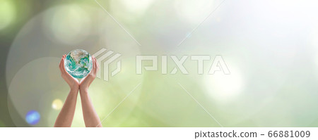 World environment day with tree planting and green planet earth on volunteering protection hands for go green and saving ecology, eco-friendly concept. Element of the image furnished by NASA 66881009