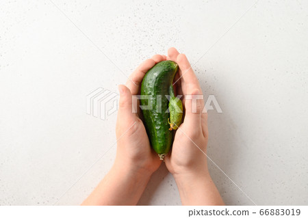 Ugly cucumbers in child hands. Concept organic 66883019