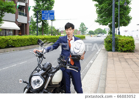 Business man commuting by motorcycle Yokohama Minatomirai 66883052