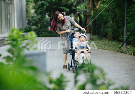 Mother and daughter outdoor having fun Mother and daughter outdoor having fun 66883364