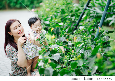 Mother and daughter outdoor having fun 66883369
