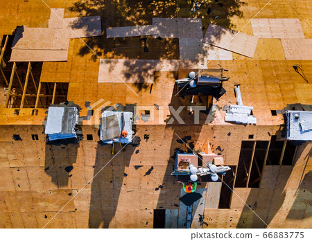 Construction worker on renovation roof the house 66883775