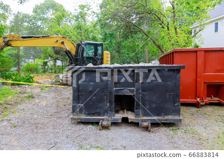 Industrial dumpster filled loaded rubbish removal 66883814