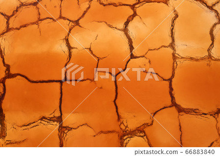 background - cracked clay is covered with water 66883840