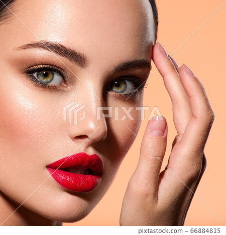 Beautiful white girl with red lips looks to the camera. Stunning blonda girl.  Stock Photo by valuavitaly