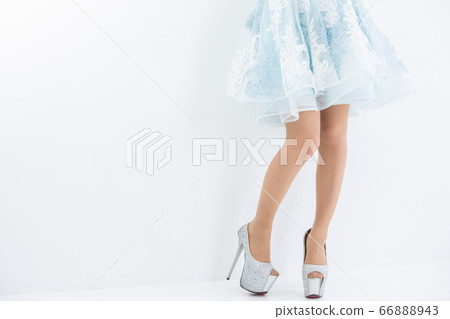 Beautiful legs model woman dress in light blue mini dress 66888943