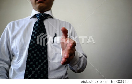 Close-up of businessmen shaking hands 66888963