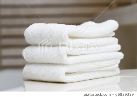 Stacked white spa towels 66889359