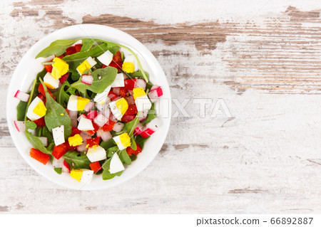 Fresh prepared salad with eggs and vegetables Fresh prepared salad with eggs and vegetables 66892887