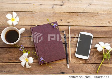 notebook diary ,mobile phone and hot coffee espresso for business work of lifestyle with white flowers frangipani notebook diary ,mobile phone and hot coffee espresso for business work of lifestyle with white flowers frangipani 66893344