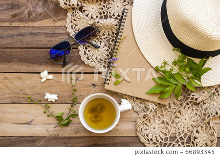 notebook planner for business work with hot chrysanthemum tea, white flowers jasmine, hat, sunglasses, knitting yarn of lifestyle woman notebook planner for business work with hot chrysanthemum tea, white flowers jasmine, hat, sunglasses, knitting yarn of lifestyle woman 66893345