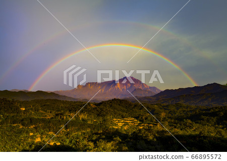 Beautiful Majestic Mount Kinabalu with rainbow background.  66895572