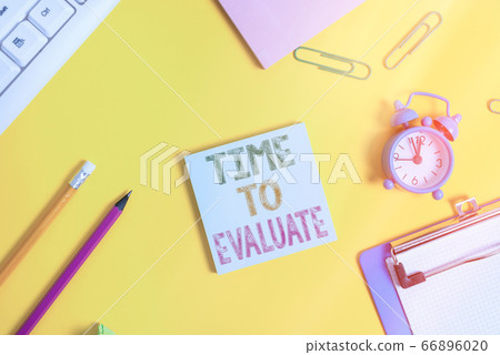 Conceptual hand writing showing Time To Evaluate 66896020