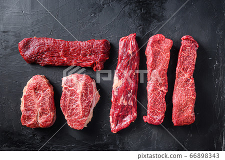 Raw organic meat Top Blade steaks near machete and Raw organic meat Top Blade steaks near machete and 66898343