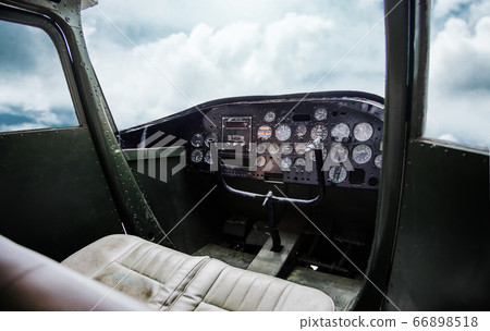 inside old pilot room in aeroplane with blue sky inside old pilot room in aeroplane with blue sky 66898518