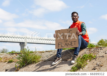 Volunteer sitting outdoors 66899312