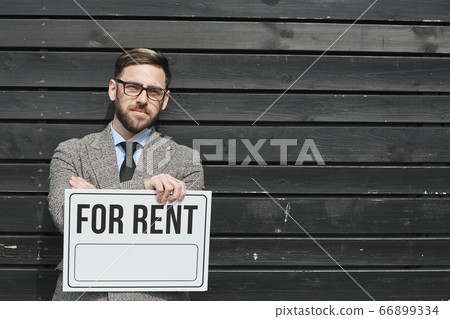 Realtor holding placard Realtor holding placard 66899334