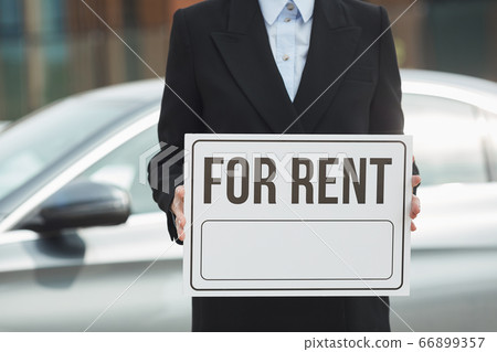 Saleswoman working in car salon Saleswoman working in car salon 66899357