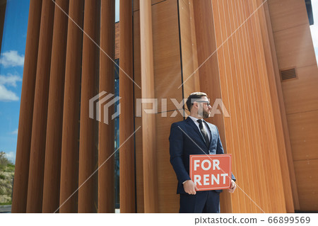 Businessman working outdoors Businessman working outdoors 66899569