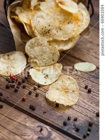 Crunchy potato crisps chips with black pepper in Crunchy potato crisps chips with black pepper in 66901084