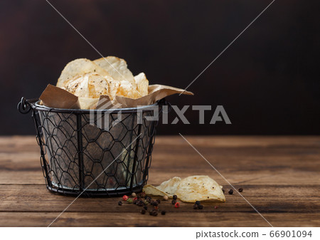 Crunchy potato crisps chips with black pepper in 66901094
