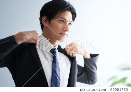 A man wearing a suit A man wearing a suit 66901780