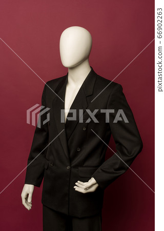 White male mannequin in a black business suit on a White male mannequin in a black business suit on a 66902263