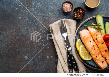 Fried salmon steak and vegetables Fried salmon steak and vegetables 66904820