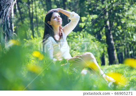 Beautiful woman in park Beautiful woman in park 66905271