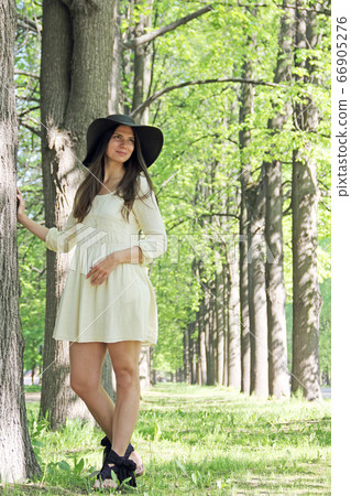 Woman in spring park Woman in spring park 66905276