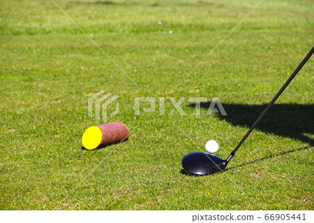 Golf ball on tee 66905441