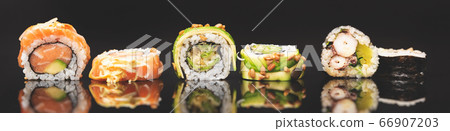 Sushi roll set on black glass background Sushi roll set on black glass background 66907203