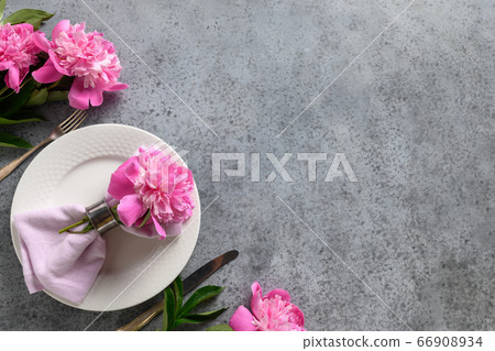 Festive table setting with pink peony 66908934
