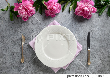Festive table setting with pink peony 66908935