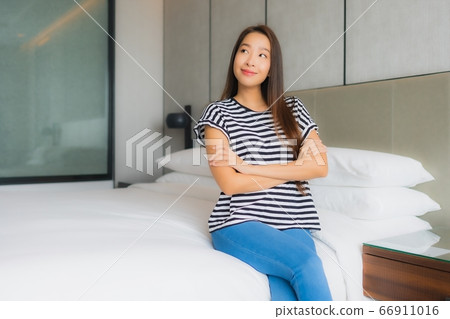 Portrait beautiful young asian woman relax happy smile in bedroom 66911016