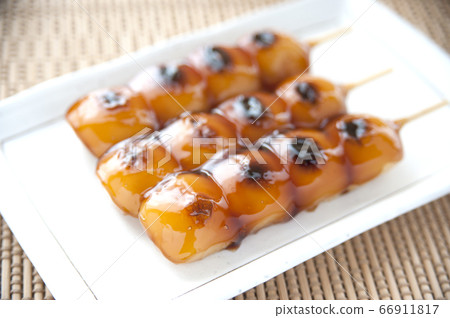 Mitarashi dumplings on a white plate Mitarashi dumplings on a white plate 66911817