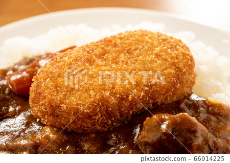 Up of croquette (oval type) on curry rice. Up of croquette (oval type) on curry rice. 66914225