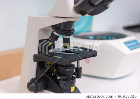scientist with equipment and science experiments, laboratory glassware containing chemical liquid 66915326
