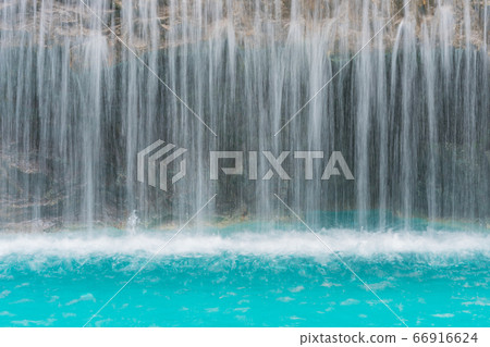landscape of beautiful Artificial waterfall in garden at the public park 66916624