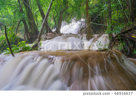 Waterfall scene at Pha Tad Waterfalls in rainforest at the Khuean Srinagarindra National Park Waterfall scene at Pha Tad Waterfalls in rainforest at the Khuean Srinagarindra National Park 66916637