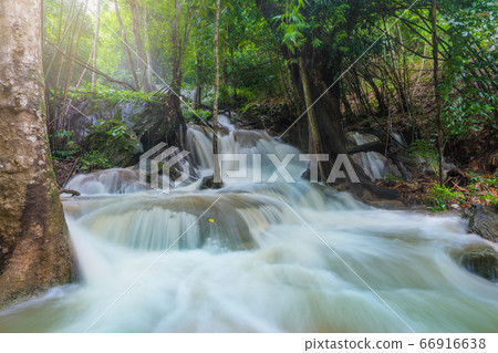 Waterfall scene at Pha Tad Waterfalls in rainforest at the Khuean Srinagarindra National Park Waterfall scene at Pha Tad Waterfalls in rainforest at the Khuean Srinagarindra National Park 66916638