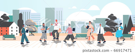 mix race businesspeople with folders walking outdoor business people office workers in urban park mix race businesspeople with folders walking outdoor business people office workers in urban park 66917471