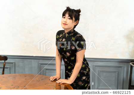 A woman in a Chinese dress A woman in a Chinese dress 66922125