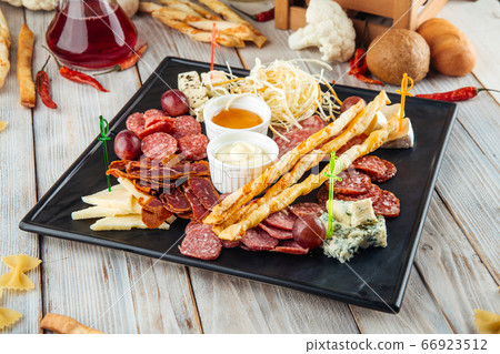 Wine appetizer set smoked sausages cheese honey Wine appetizer set smoked sausages cheese honey 66923512