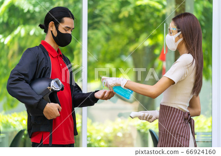 Restaurant waitress push hand sanitizer gel for 66924160