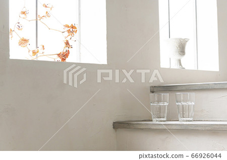 Cup placed on the stairs with windows 66926044